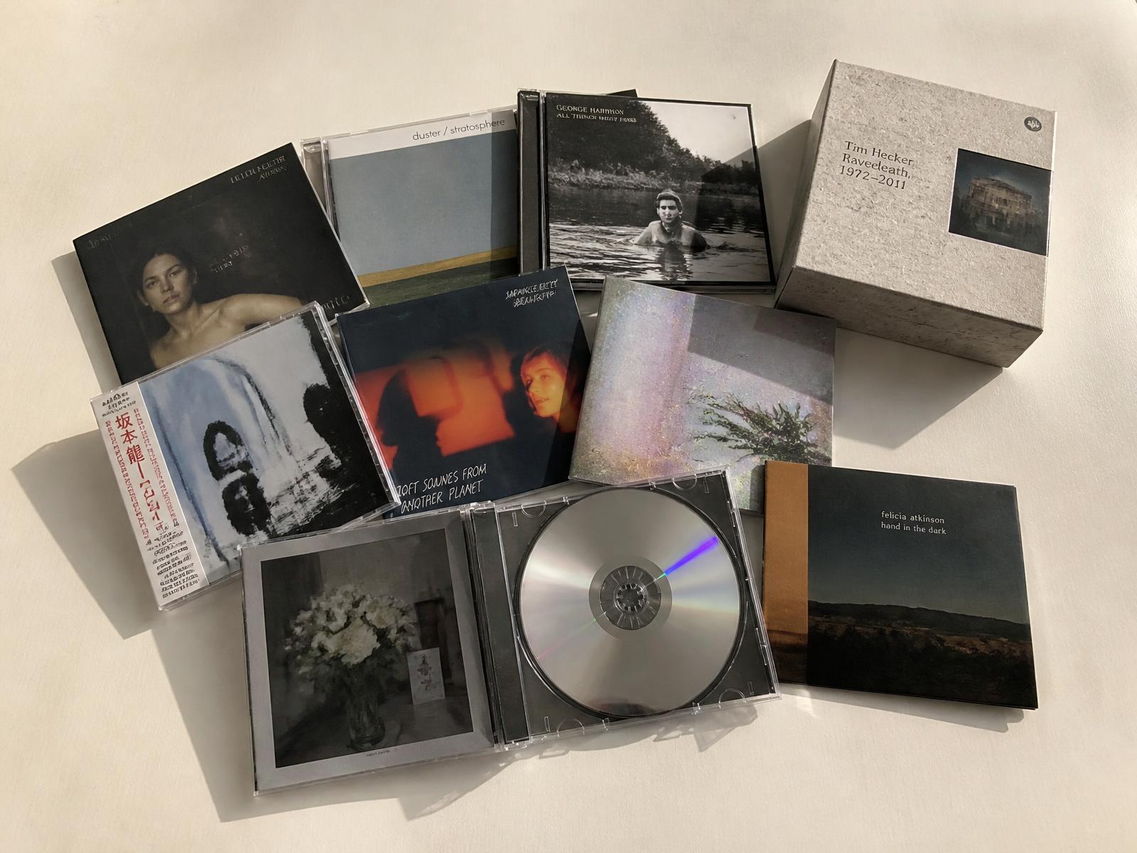 Stacks of CD jewel cases on a record shop counter